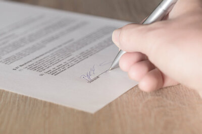 HRMS contract - man signing contract