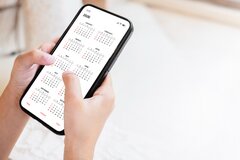 mobile HRMS app - person holding phone